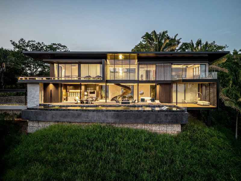 Completed modern home at Nosara Estates in Nosara showing finished exterior, landscaping, and driveway access