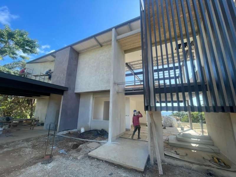 Home under construction at Nosara Estates showing structural progress and building framework in Nosara
