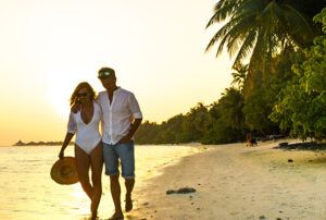 Happy Couple Walking on the Beach