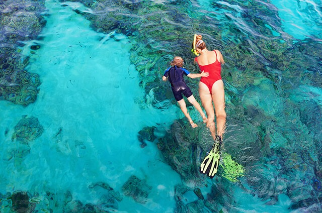 Family Snorkeling on the Ocean