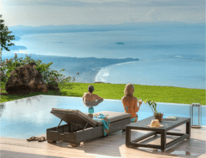 Retired couple enjoying ocean view from Nosara Home